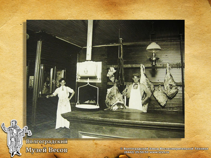 Weighing meat. Old-time photograph depicting scales.
