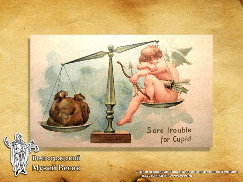 Postcard with a picture of a cupid sitting on the scales