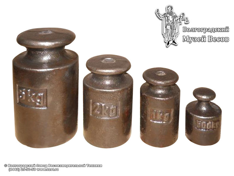 Cylindrical trade weights of 5 kg, 2 kg, 1 kg and 50 decagram nominal value. Europe, 20th century