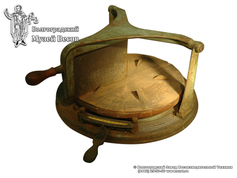 Cheese cutting device with the weighing function. USA, the early XX century.