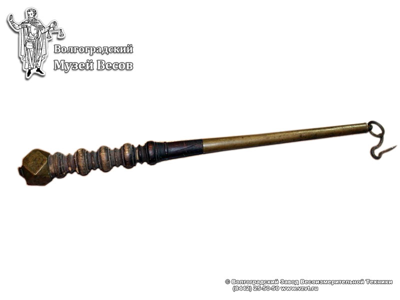 Metal-wooden scalebeam with decorative elements on the crowbar and weight. Russia, the first half of the 19th century
