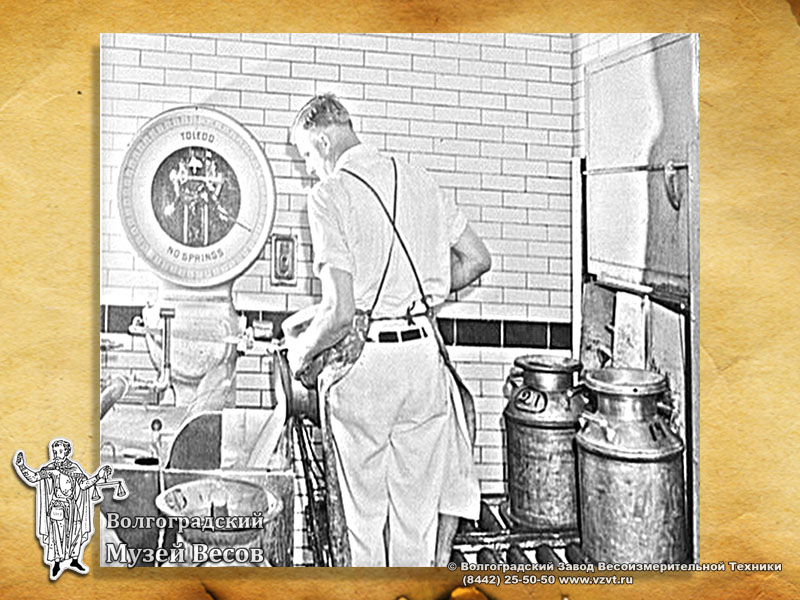 Weighing milk. Old photograph depicting Toledo scales.