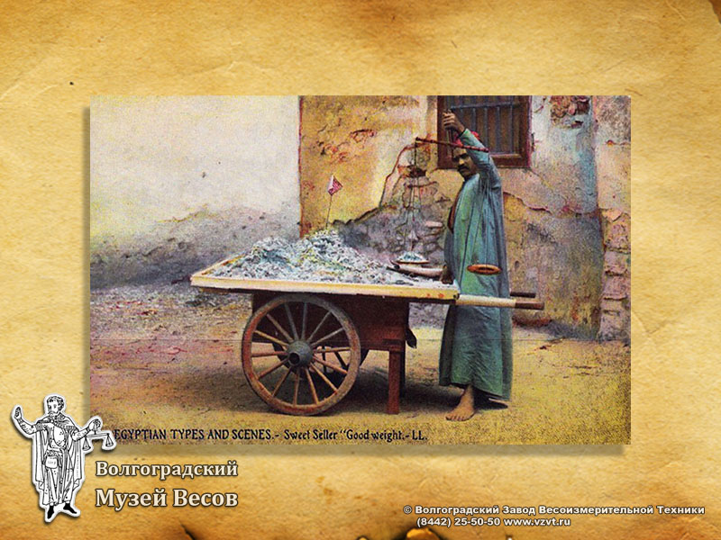 A seller of sweets in Egypt. Postcard with the picture of scales.