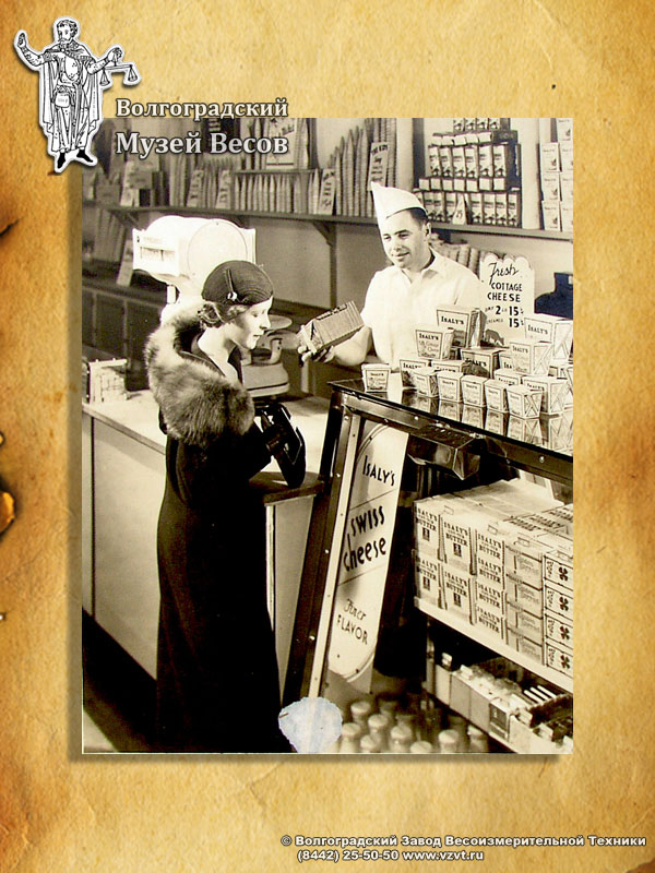 Purchasing at the shop. Old-time photograph depicting scales.