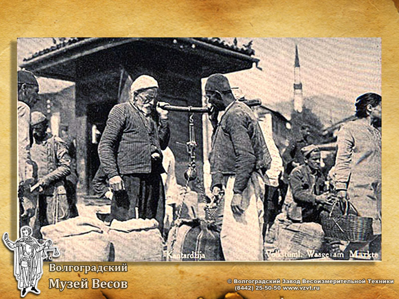 Weighing of bags in the market. A postcard with the picture of scales.