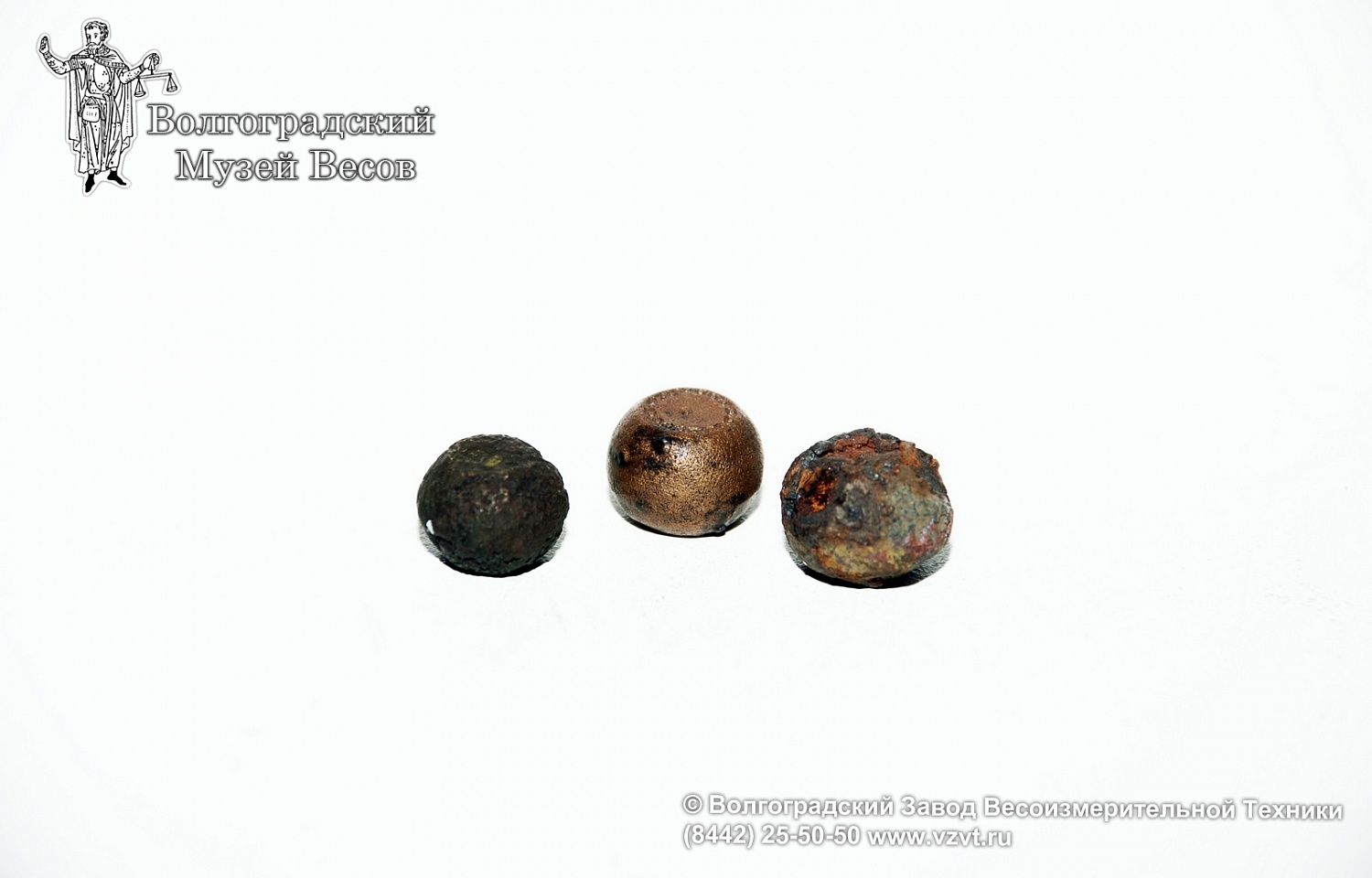 Barrel-shape iron weights in a bronze case-shell. Russia, the 12th – 16th centuries.