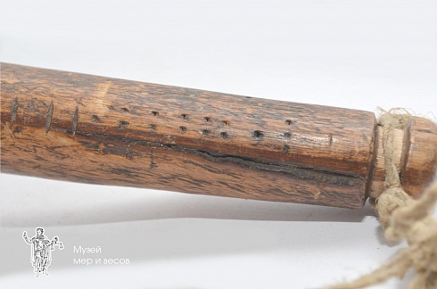 Wooden scalebeam with a hanging pan