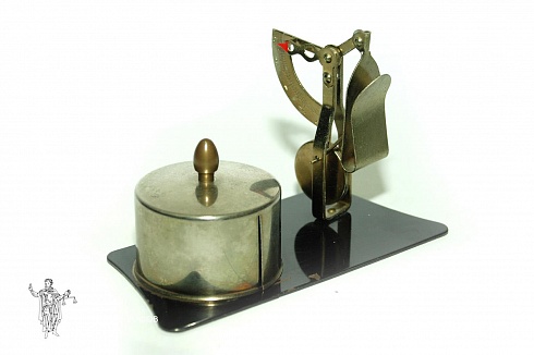 Letter scales with a container for stamps
